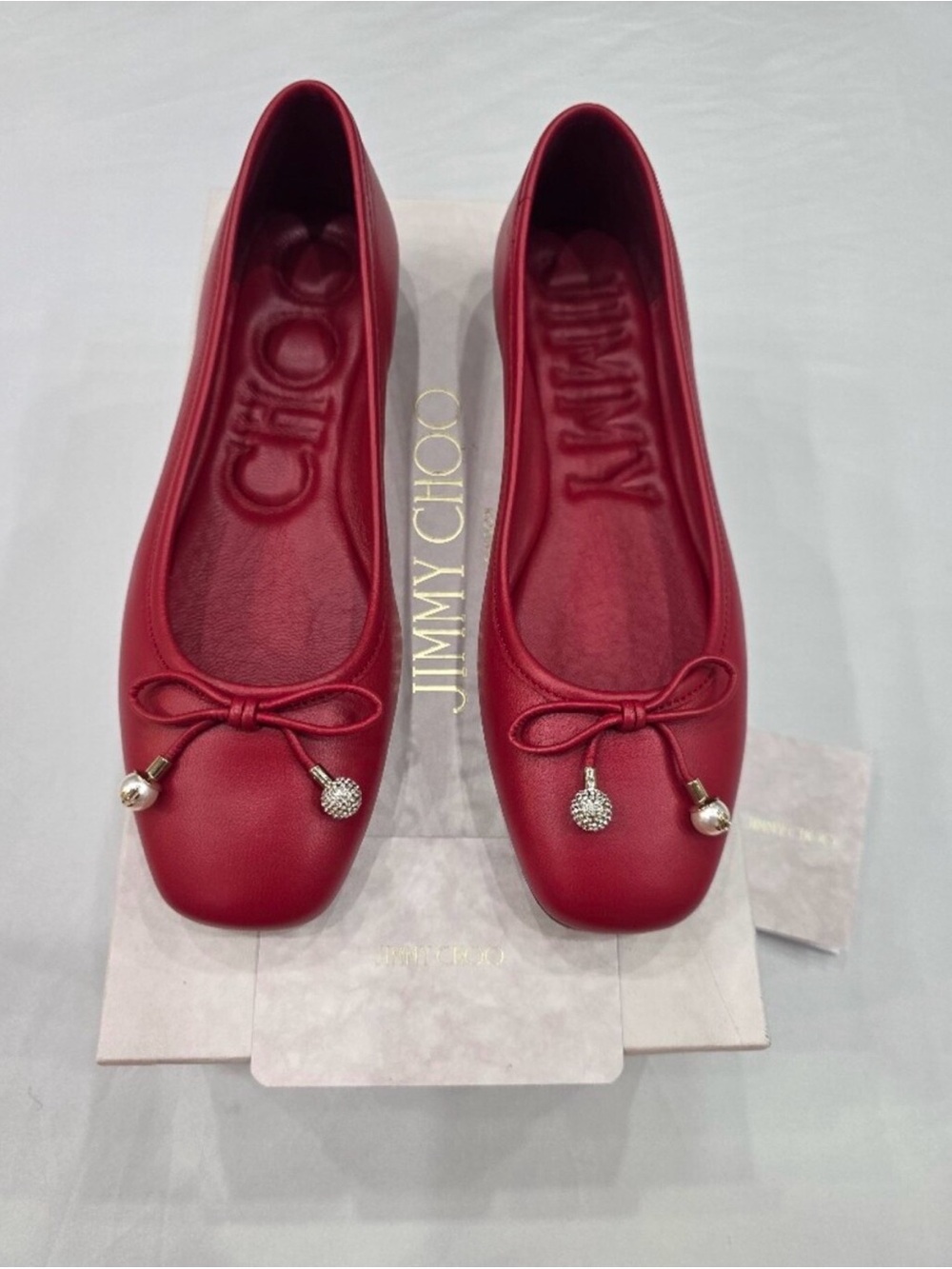 Jimmy Choo Red Leather Ballet Flats with Bow and Pom Charms